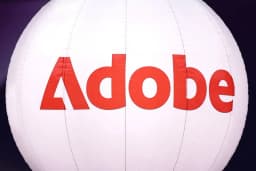 Adobe company logo displayed at a technology summit in Paris, November 2025