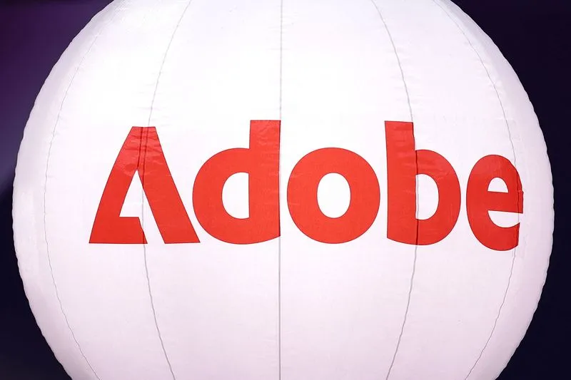 Adobe company logo displayed at a technology summit in Paris, November 2025