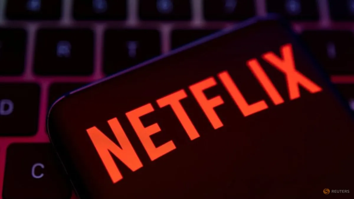 A smartphone displaying the Netflix logo rests on a keyboard in a Reuters illustration about Netflix's U.S. subscription price increase