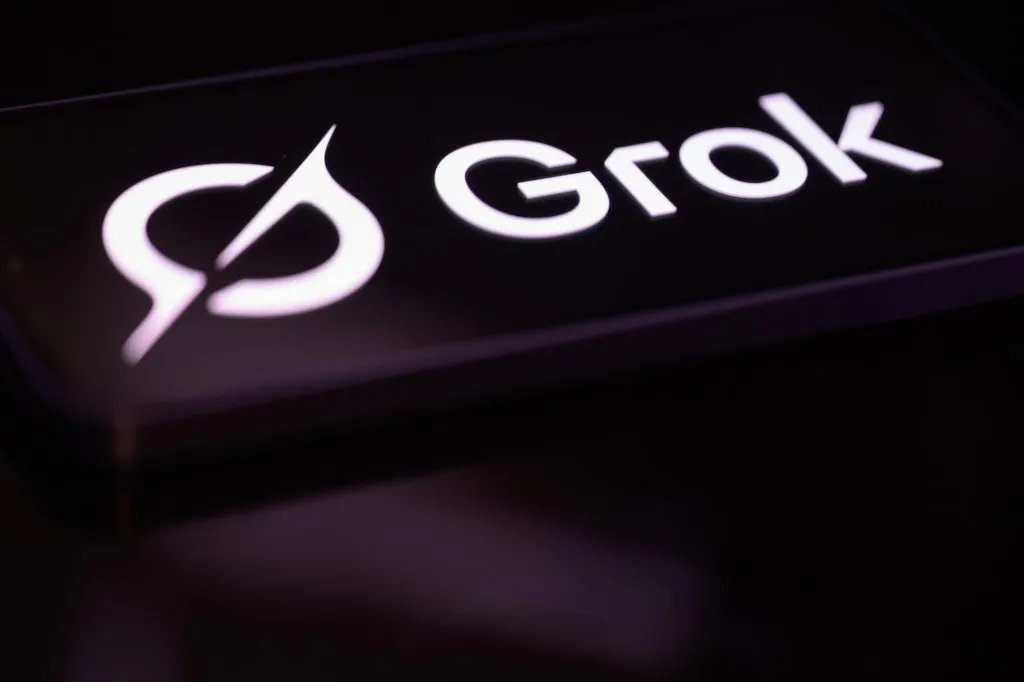 The Grok AI chatbot logo displayed on a screen, the artificial intelligence tool developed by Elon Musk's xAI company that is the subject of a class-action lawsuit filed by Tennessee teenagers