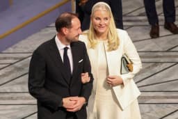 Crown Princess Mette-Marit of Norway photographed alongside Crown Prince Haakon during their NRK television interview about her ties to Jeffrey Epstein