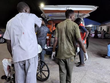 Nigerian Red Cross members assist wounded victims into an ambulance after multiple explosions struck Maiduguri, Borno State, Nigeria, March 16, 2026