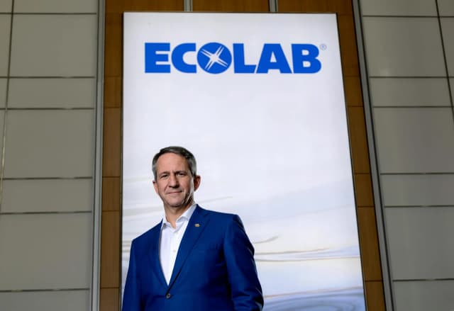 Ecolab CEO Christophe Beck at a press event discussing the company's expansion into AI data center cooling technology