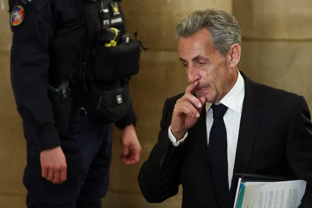 Former French President Nicolas Sarkozy arrives at the Paris Court of Appeal for the opening of his appeal trial over alleged Libyan campaign financing, March 16, 2026
