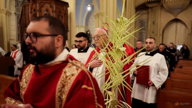 Christian worshippers gather for Palm Sunday prayers in Jerusalem’s Old City after Israeli police blocked Cardinal Pierbattista Pizzaballa from entering the Church of the Holy Sepulchre on March 29, 2026.
