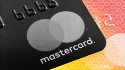Mastercard credit card placed on a computer keyboard, illustrating the payments giant's push into digital currency infrastructure with the $1.8 billion BVNK acquisition