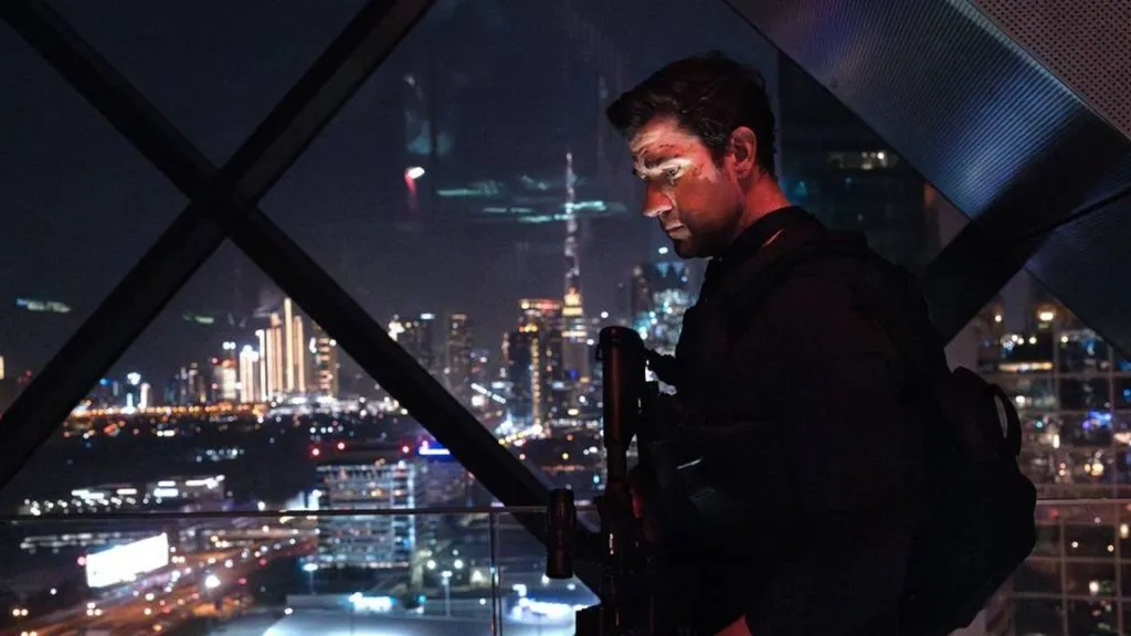 John Krasinski as Jack Ryan in a promotional still from Jack Ryan: Ghost War, the upcoming Prime Video film premiering May 20, 2026