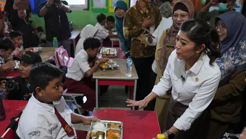 Indonesian Information and Digital Affairs Minister Meutya Hafid at an elementary school in Depok, West Java, in a file photo used alongside coverage of Indonesia's under-16 social media restrictions.