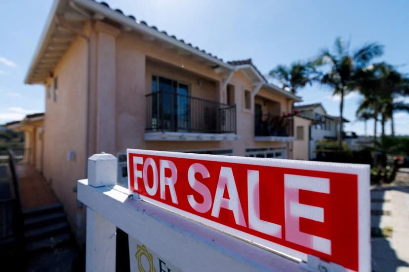 A for-sale sign stands outside a residential home in Encinitas, California, symbolizing the current state of the US housing market