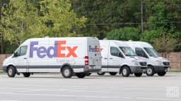 A FedEx delivery truck on the road, representing the logistics giant's strong fiscal third-quarter performance
