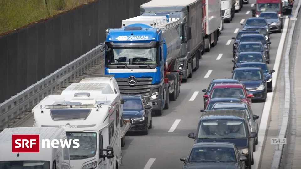 Traffic queue of cars and trucks on the motorway approaching the Gotthard corridor during Easter travel in Switzerland