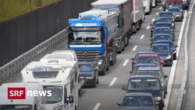 Traffic queue of cars and trucks on the motorway approaching the Gotthard corridor during Easter travel in Switzerland