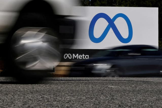 Cars pass a Meta sign outside the company headquarters in Menlo Park, California, in a Reuters file photo by Carlos Barria