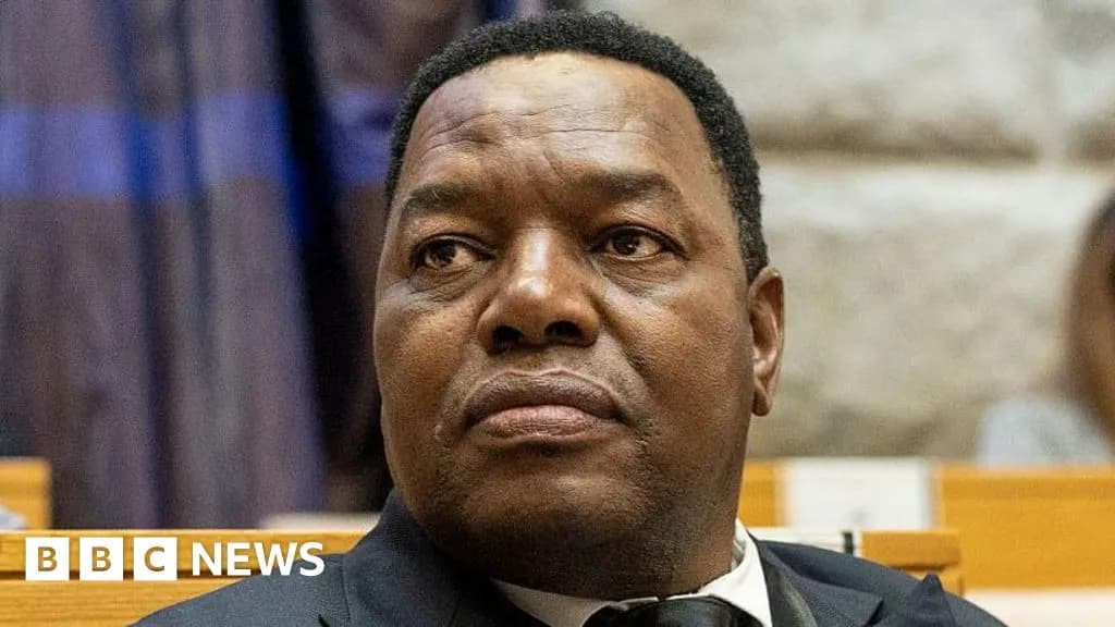 South Africa police commissioner Fannie Masemola speaks to reporters outside court in Pretoria