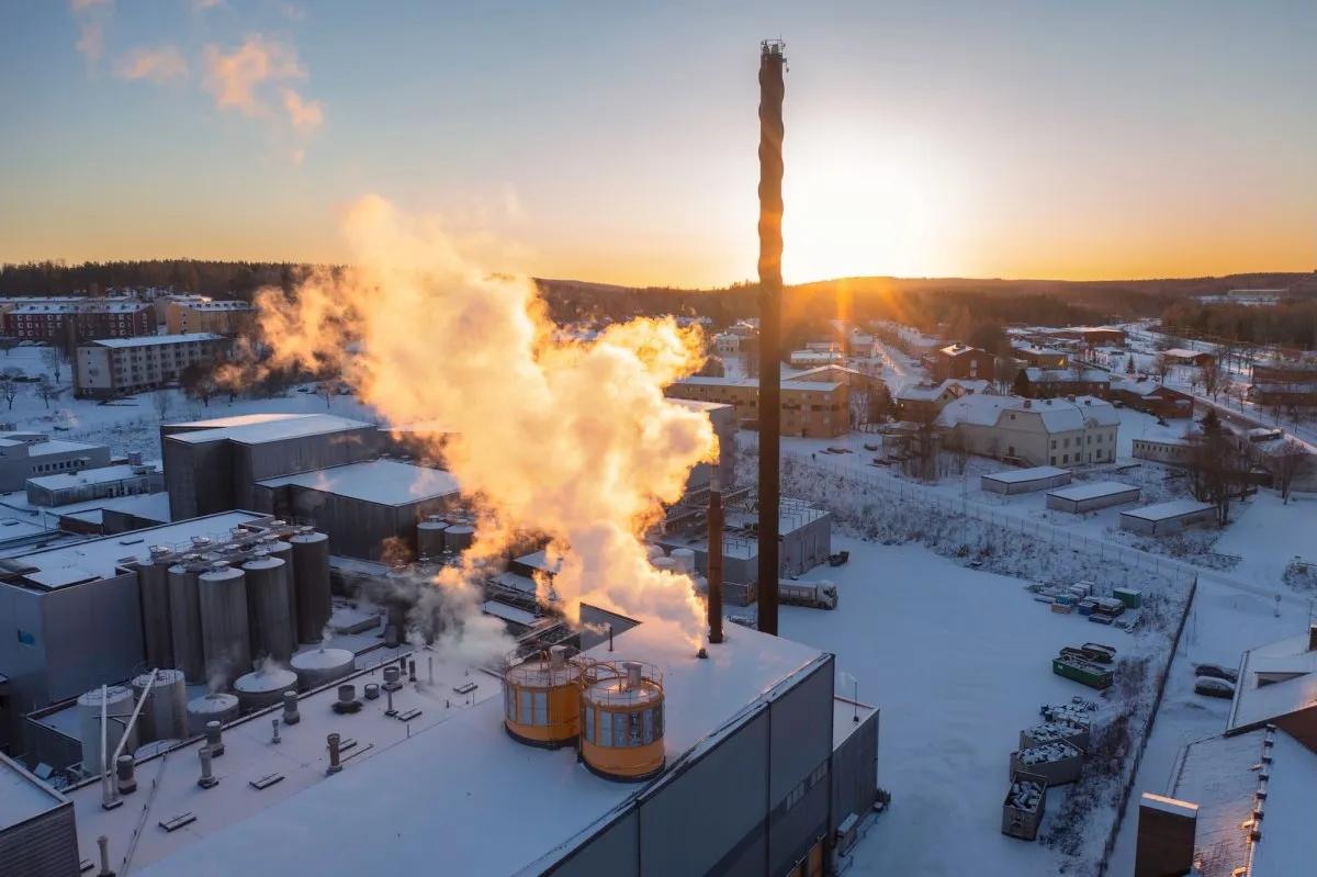 Aerial view of a Swedish thermal power facility and surrounding industrial buildings in winter