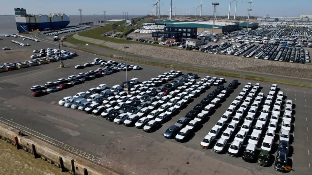 Volkswagen vehicles lined up for export at the seaport of Emden in Germany in a Reuters photo used to illustrate automakers' US investment and tariff planning