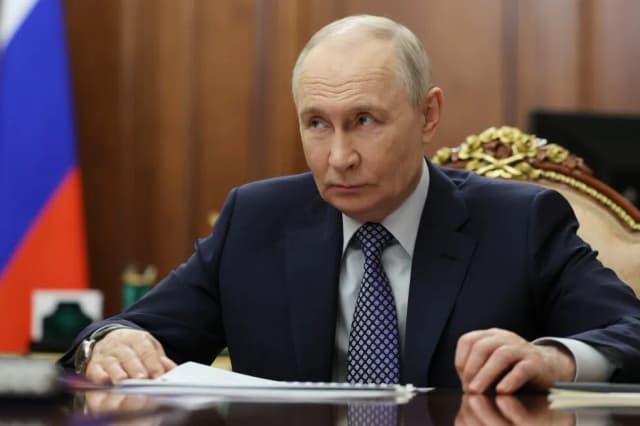 Russian President Vladimir Putin listens during a Kremlin meeting in Moscow in an AP pool photo used as cover art for coverage of the Easter ceasefire announcement
