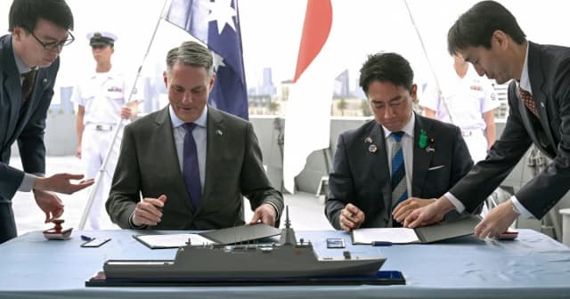 Australian Defence Minister Richard Marles and Japanese Defence Minister Koizumi Shinjiro sign the Mogami warship memorandum in Melbourne