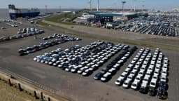 Volkswagen vehicles lined up for export at the seaport of Emden in Germany in a Reuters photo used to illustrate automakers' US investment and tariff planning