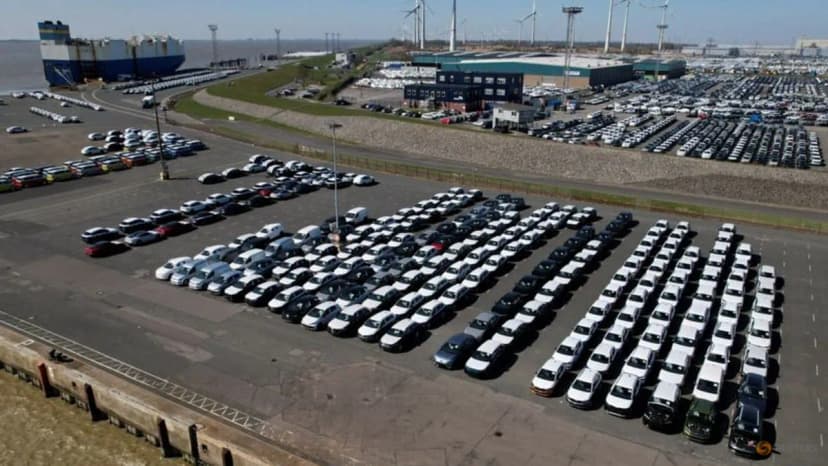 Volkswagen vehicles lined up for export at the seaport of Emden in Germany in a Reuters photo used to illustrate automakers' US investment and tariff planning