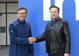 Intel chief executive Lip-Bu Tan shakes hands with Elon Musk in a company photo released around the Terafab partnership