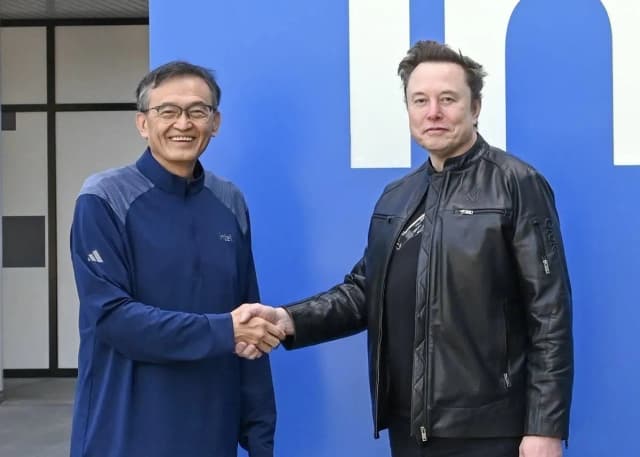 Intel chief executive Lip-Bu Tan shakes hands with Elon Musk in a company photo released around the Terafab partnership