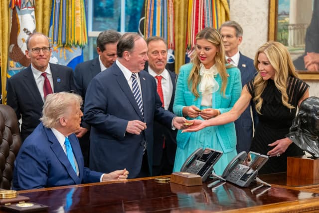 President Donald Trump swearing in John Phelan as Secretary of the Navy at the White House