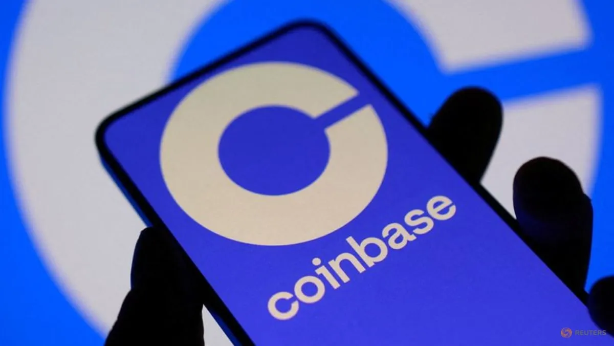 A Coinbase logo displayed on a smartphone screen in a Reuters file illustration used to accompany coverage of New York's lawsuit over prediction markets.