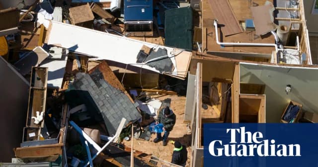 Aerial view of tornado damage in Lena, Illinois, on April 18, 2026, showing damaged homes, debris and stripped trees after severe storms