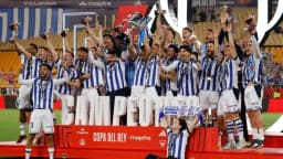 Real Sociedad captain Mikel Oyarzabal celebrates with teammates after the Copa del Rey final win over Atletico Madrid in Seville on April 18, 2026