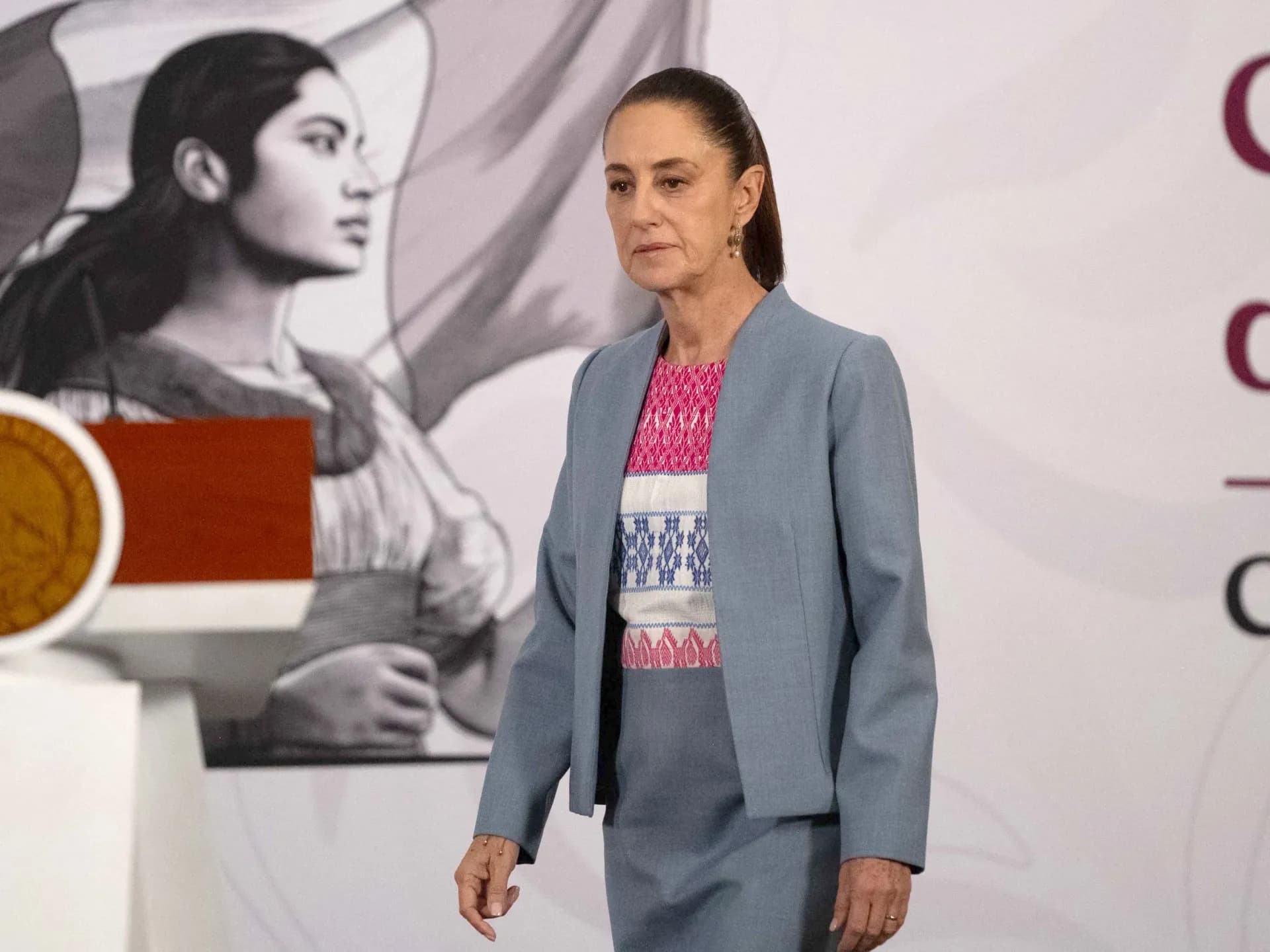 Mexico's President Claudia Sheinbaum arrives for a morning news conference at the National Palace in Mexico City.