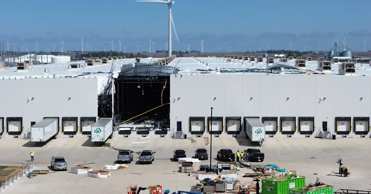 Aerial view of storm damage at Rivian’s Normal, Illinois plant, including the newer Building 2 area used to support the R2 rollout