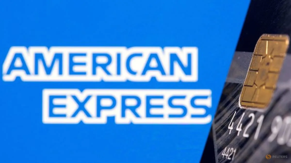 American Express credit card shown in front of the American Express logo in a Reuters illustration