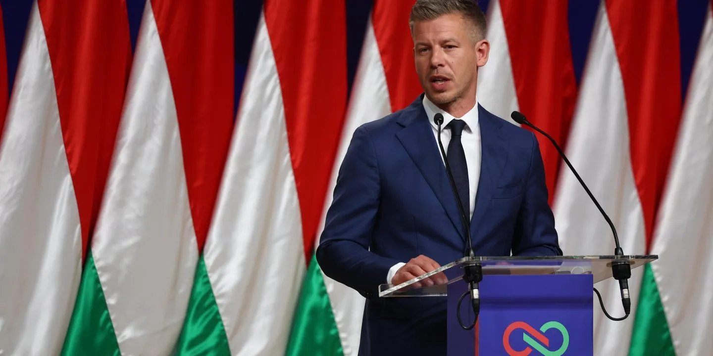 Péter Magyar speaks at a lectern during a news conference after outlining his Hungary policy toward Israel and the ICC.