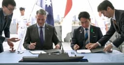 Australian Defence Minister Richard Marles and Japanese Defence Minister Koizumi Shinjiro sign the Mogami warship memorandum in Melbourne