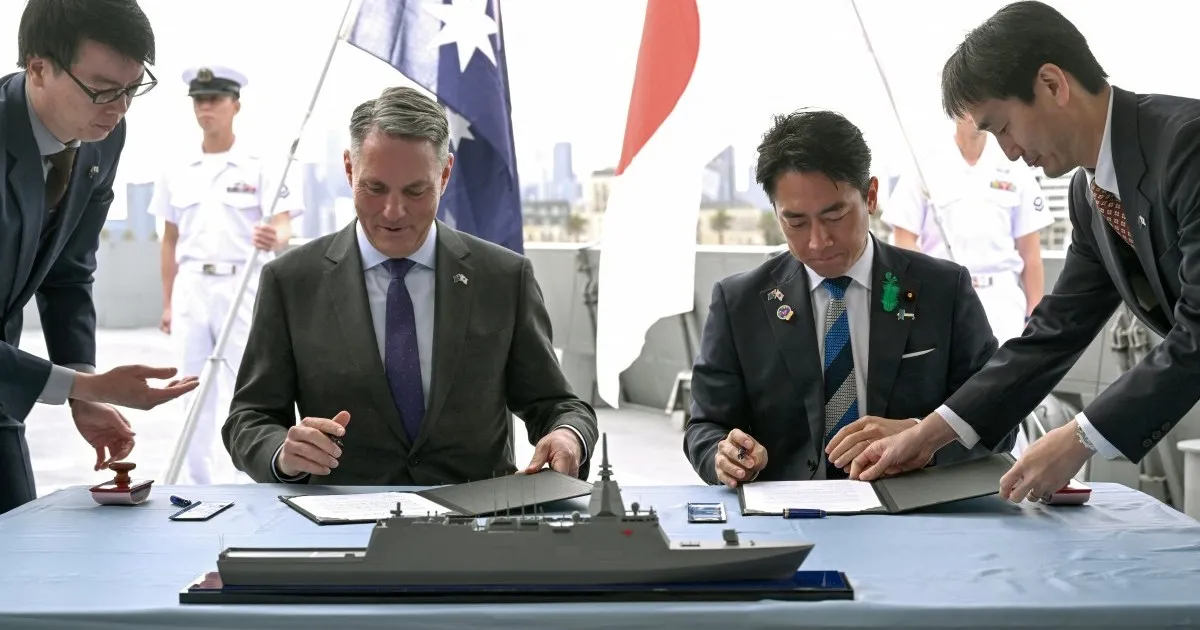 Australian Defence Minister Richard Marles and Japanese Defence Minister Koizumi Shinjiro sign the Mogami warship memorandum in Melbourne