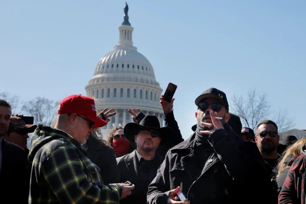 Enrique Tarrio, Stewart Rhodes and Joseph Biggs gather outside the U.S. Capitol in Washington in a Reuters file photo used by PBS coverage of the Jan. 6 conviction-vacatur story