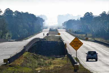Community members gather at Twin Rivers Missionary Baptist Church as wildfire smoke hangs over Brantley County, Georgia
