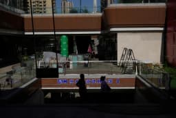 Partially shuttered Evergrande commercial complex in Beijing, photographed by AP, illustrating the company at the center of Hui Ka Yan's guilty plea case