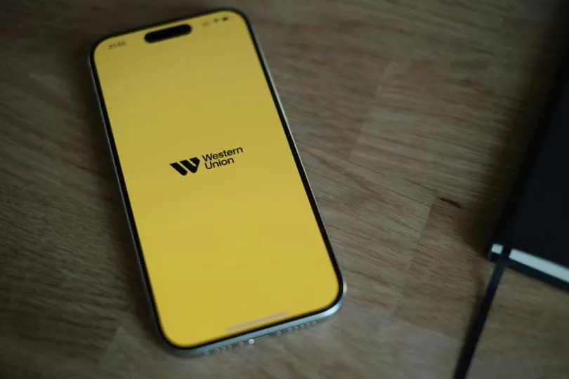 Street-level photo illustrating Western Union branding as the company launches its USDPT stablecoin on Solana.