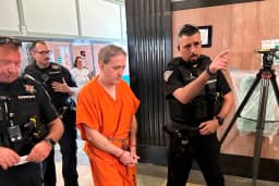 Richard Glossip is led into the Oklahoma County Courthouse by sheriff's deputies during proceedings tied to his retrial case