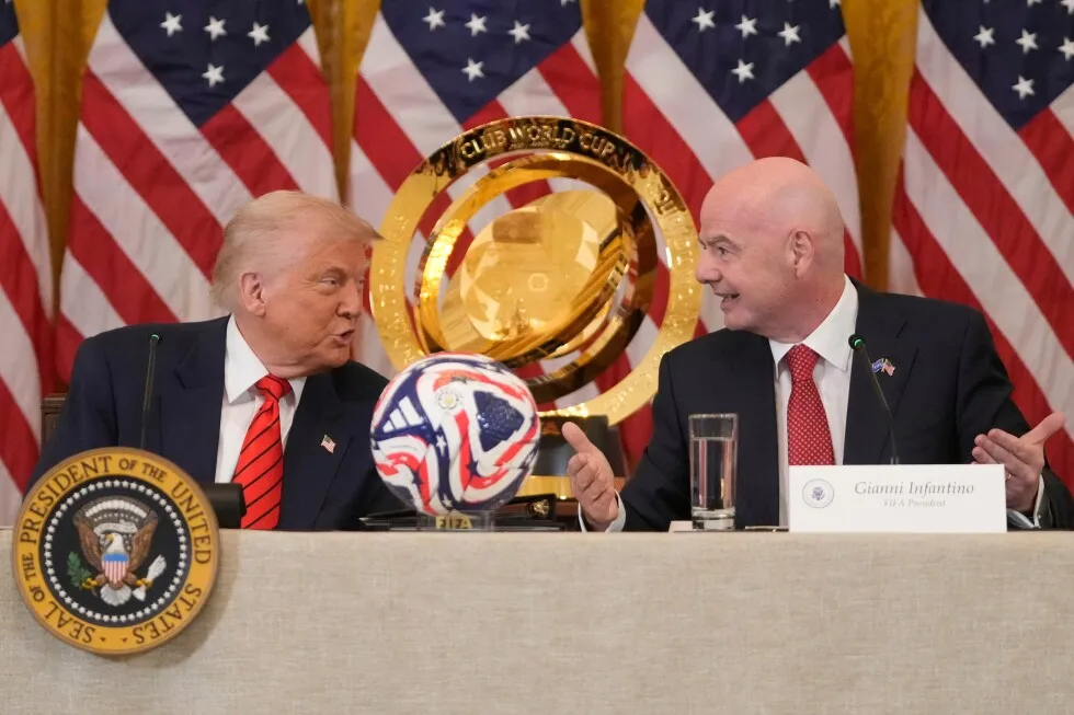 President Donald Trump speaks with FIFA President Gianni Infantino during a White House World Cup task force meeting