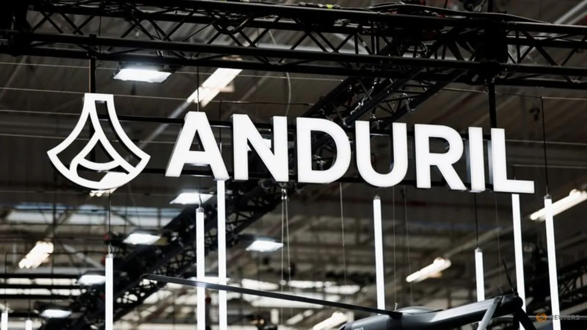 The Anduril Industries logo on a dark display panel at an air show.