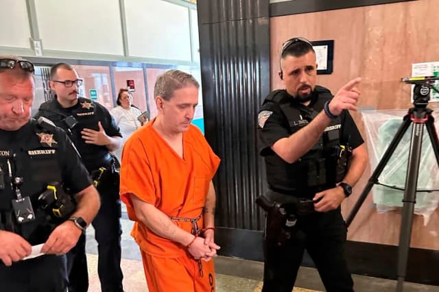 Richard Glossip is led into the Oklahoma County Courthouse by sheriff's deputies during proceedings tied to his retrial case