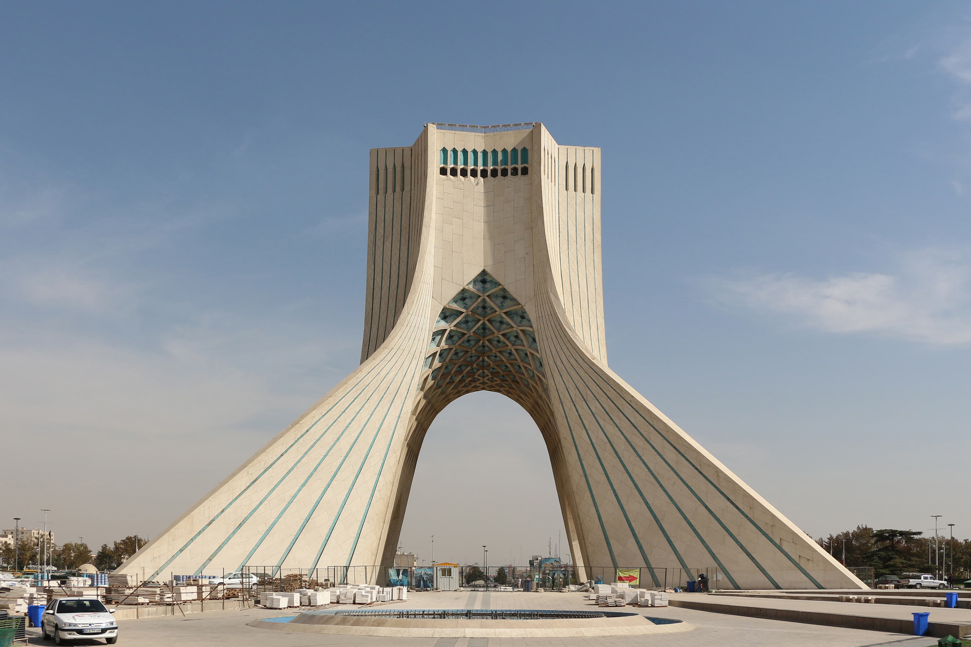 The Azadi Tower in Tehran, Iran, a large white marble monument under a blue sky