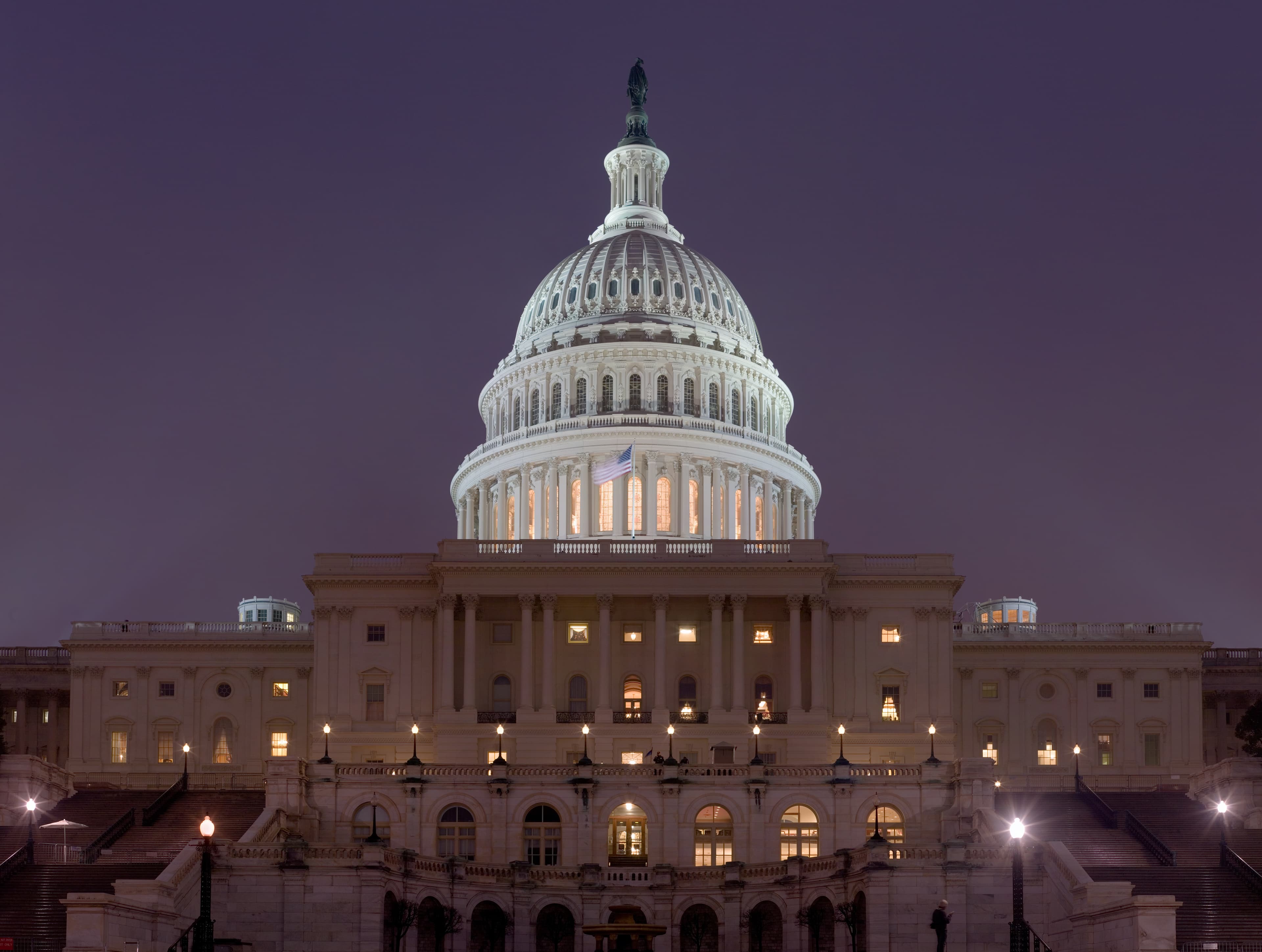 The United States Capitol building illuminated at night in Washington, D.C.
