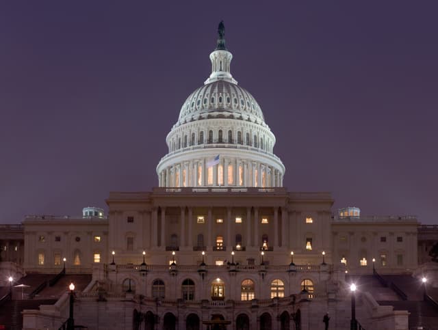 The United States Capitol building illuminated at night in Washington, D.C.