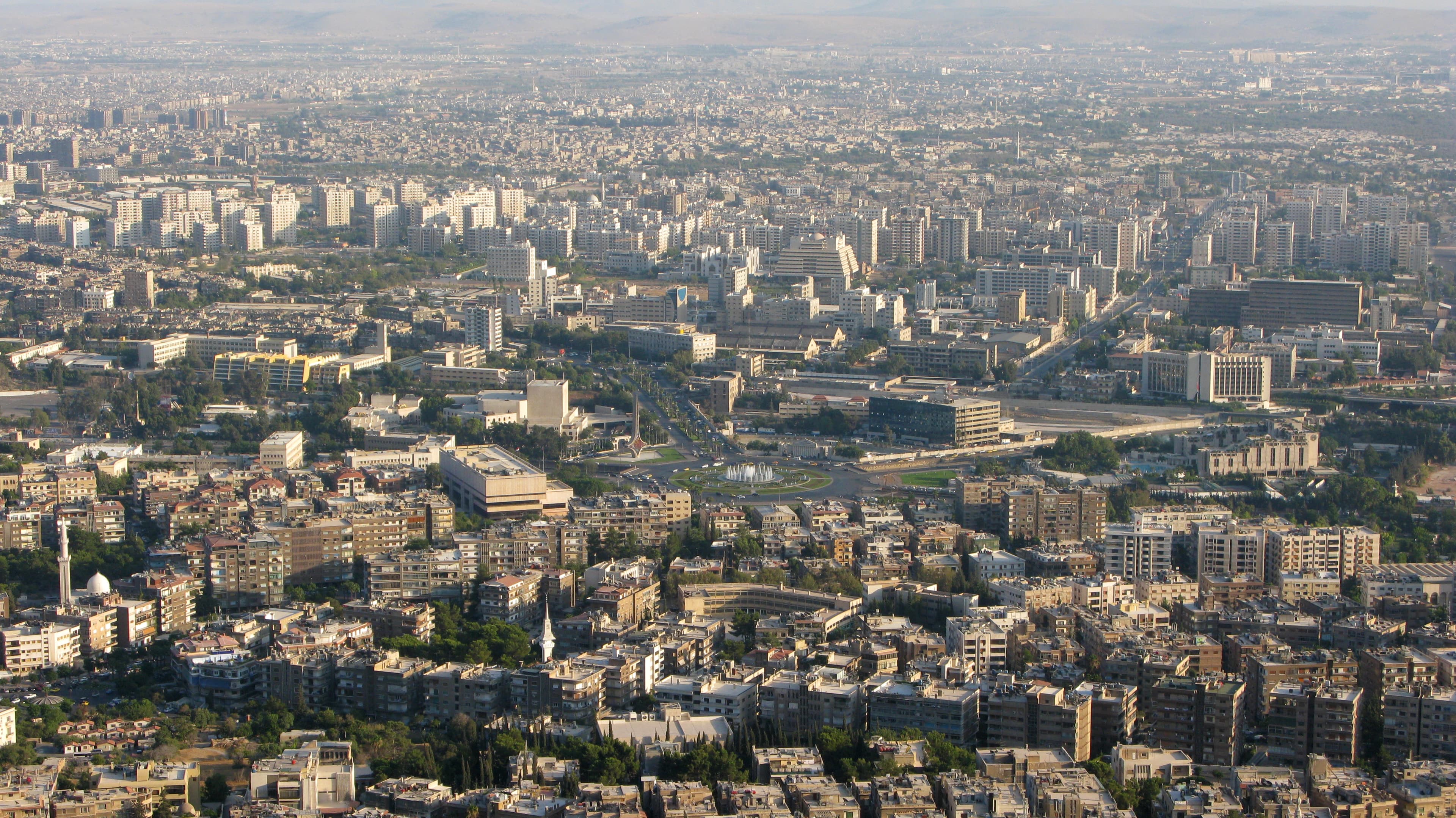 Panoramic view of Damascus, Syria at sunset showing the city skyline