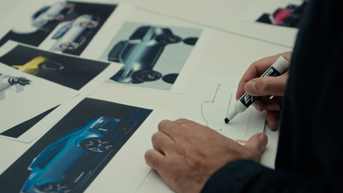 Early design renderings of Ford's upcoming midsize electric pickup truck built on the Universal EV Platform, showing an aerodynamic profile with a teardrop-shaped roofline