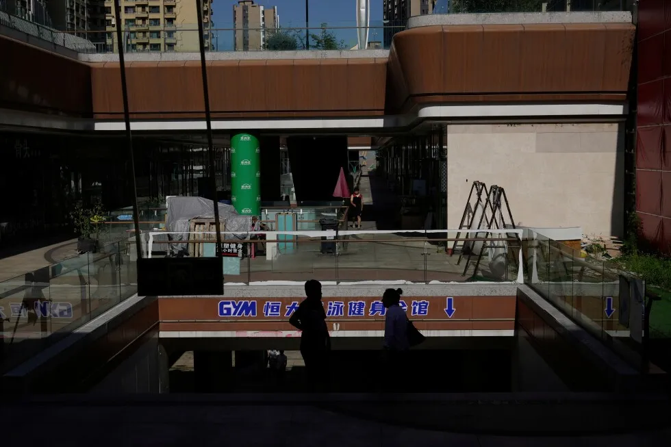 Partially shuttered Evergrande commercial complex in Beijing, photographed by AP, illustrating the company at the center of Hui Ka Yan's guilty plea case